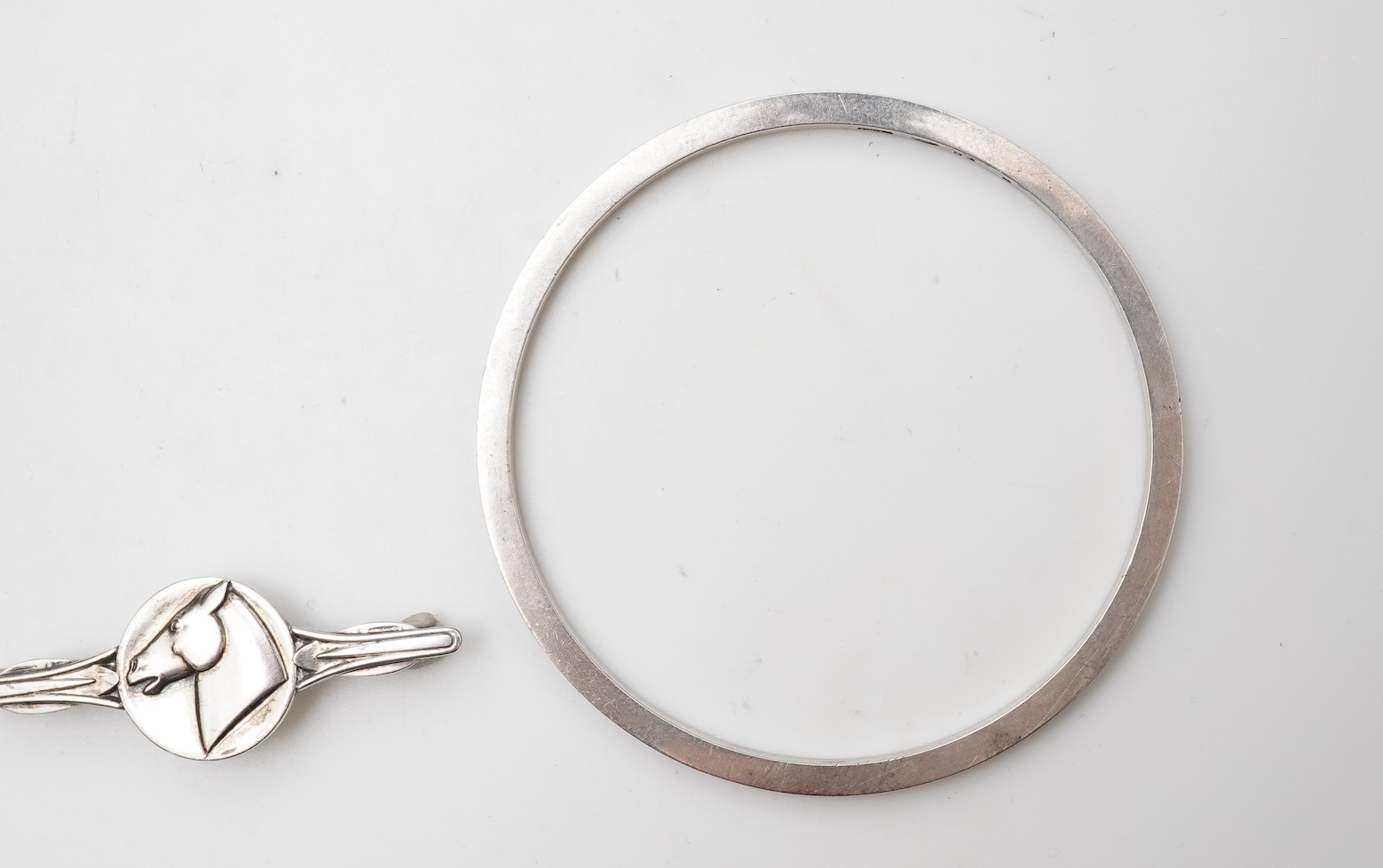 Georg Jensen, a bangle, circa 1964, and brooch, second half 20th century